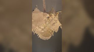 Vea por qué elegir una lámpara de araña de cristal ovalada personalizada con acabado dorado, recepción de hotel, comedor, club de lujo